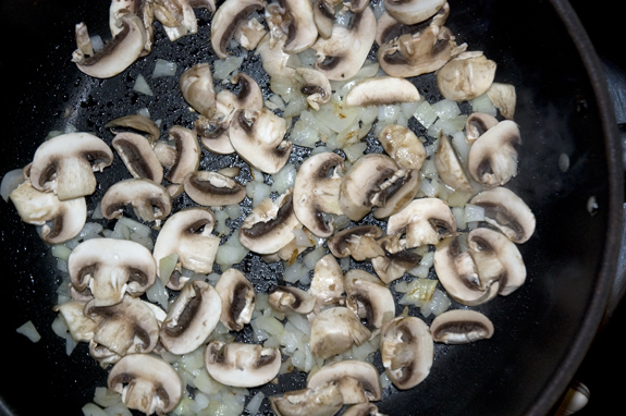 mushroom slices added to pan