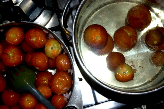 Tomatoes boiling for skinning